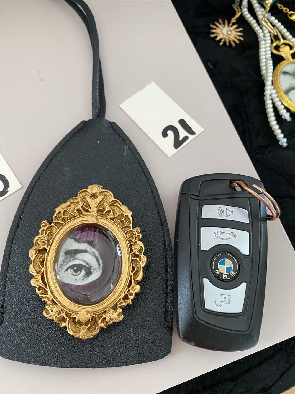 Black Leather Pendant Bag with Gold Frame Accent